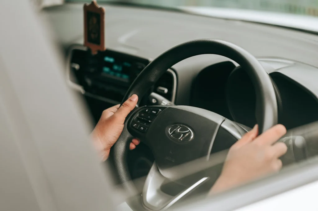 Hands on a steering wheel